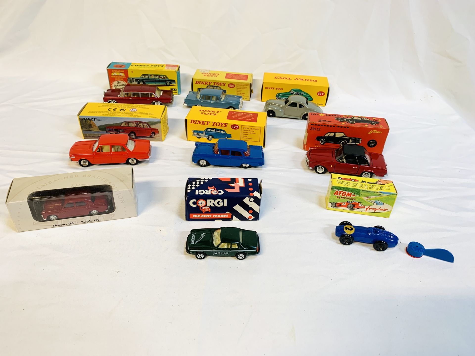 Nine boxed diecast cars including Dinky and Corgi