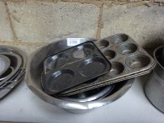 Four mixing bowls and two cake tins