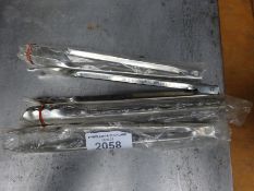 Four stainless steel tongs