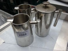 Three stainless steel jugs