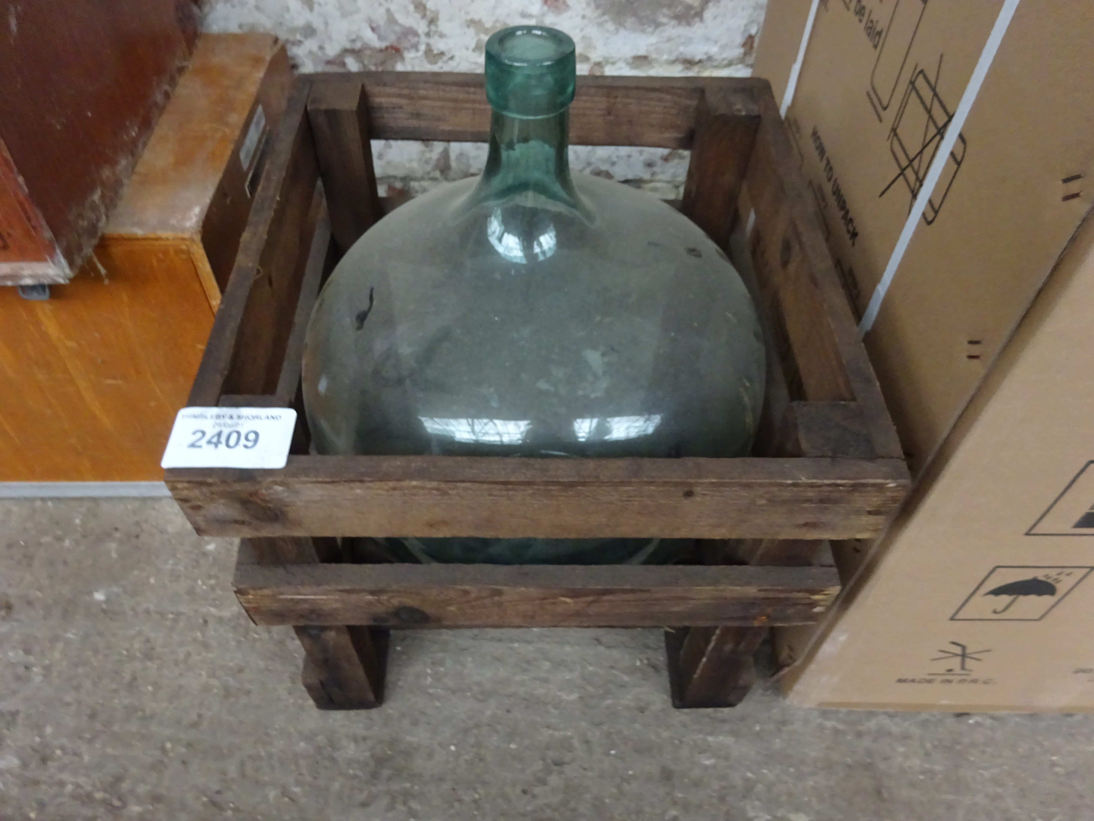 Glass jug in crate