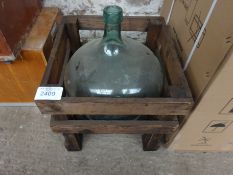 Glass jug in crate