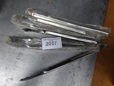 Four stainless steel tongs