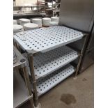 Three tier table with perforations