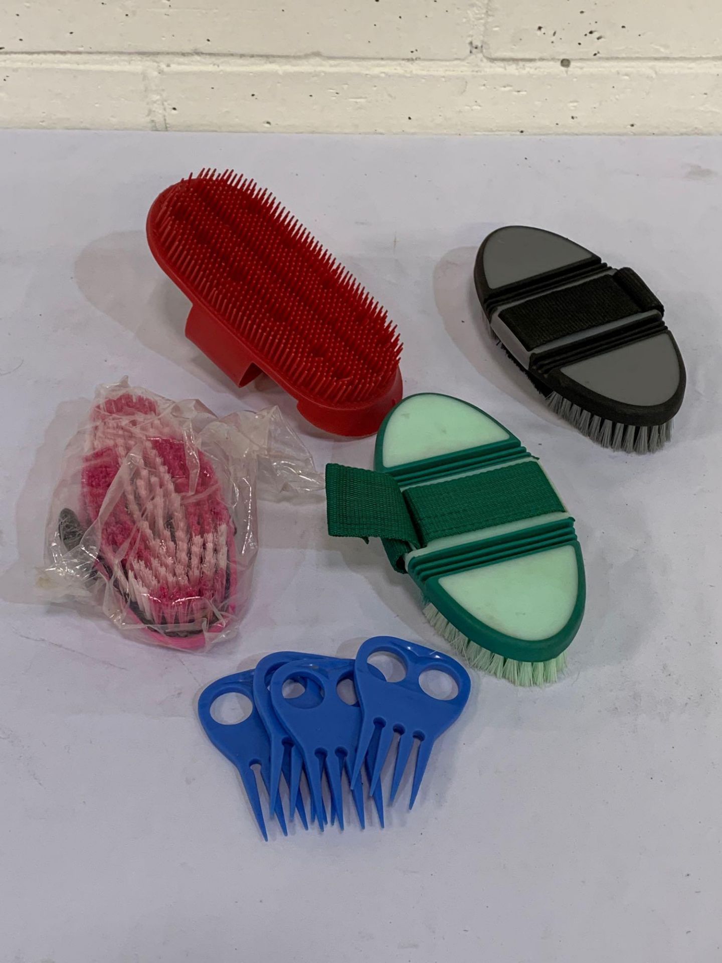 Grooming brushes and combs