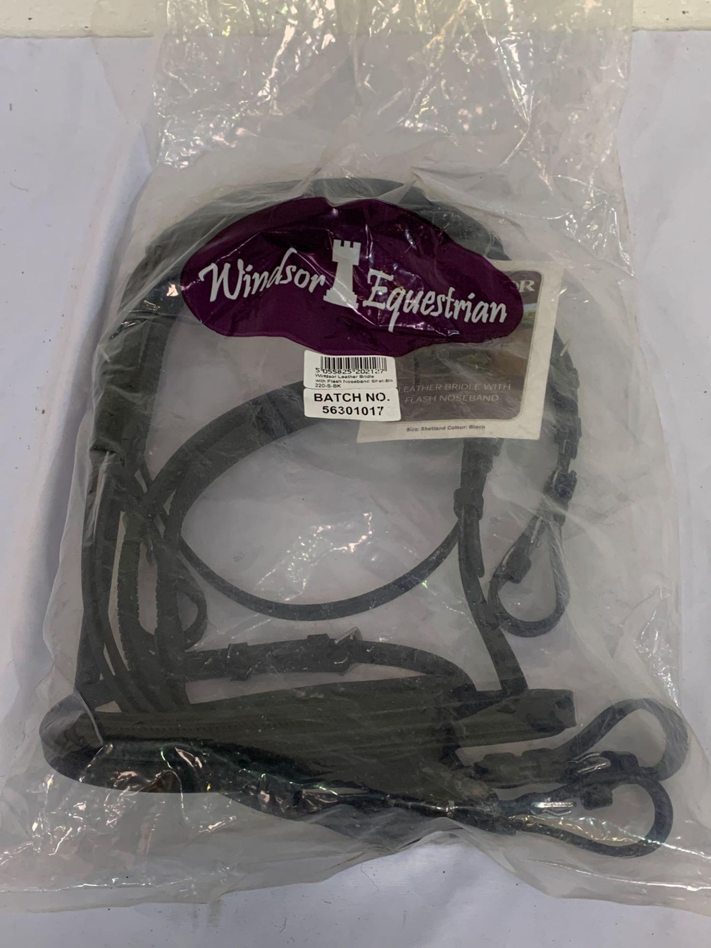 Two Windsor black leather bridles with flash nosebands.