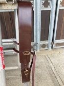 Brown/brass in-hand roller and side reins