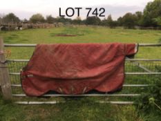 Rambo 6ft 3ins turnout rug, with three surcingles and a broken front clip.