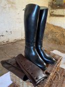 Pair of black rubber riding boots and brown leather gaiters