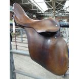 Brown leather hunting saddle by Barnsby & Son, Walsall.