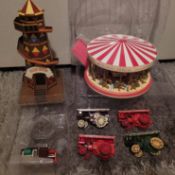 Model of a horse carousel, a helter skelter and three steam engines by Days Gone By.