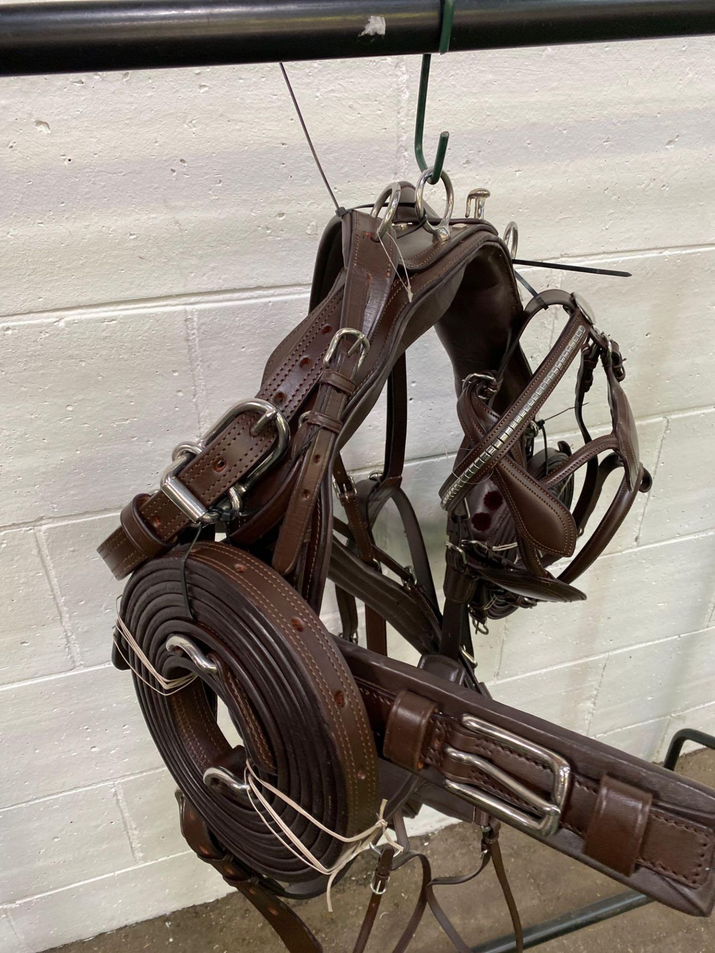 Set of brown pony harness with quick release tug. This item carries VAT.