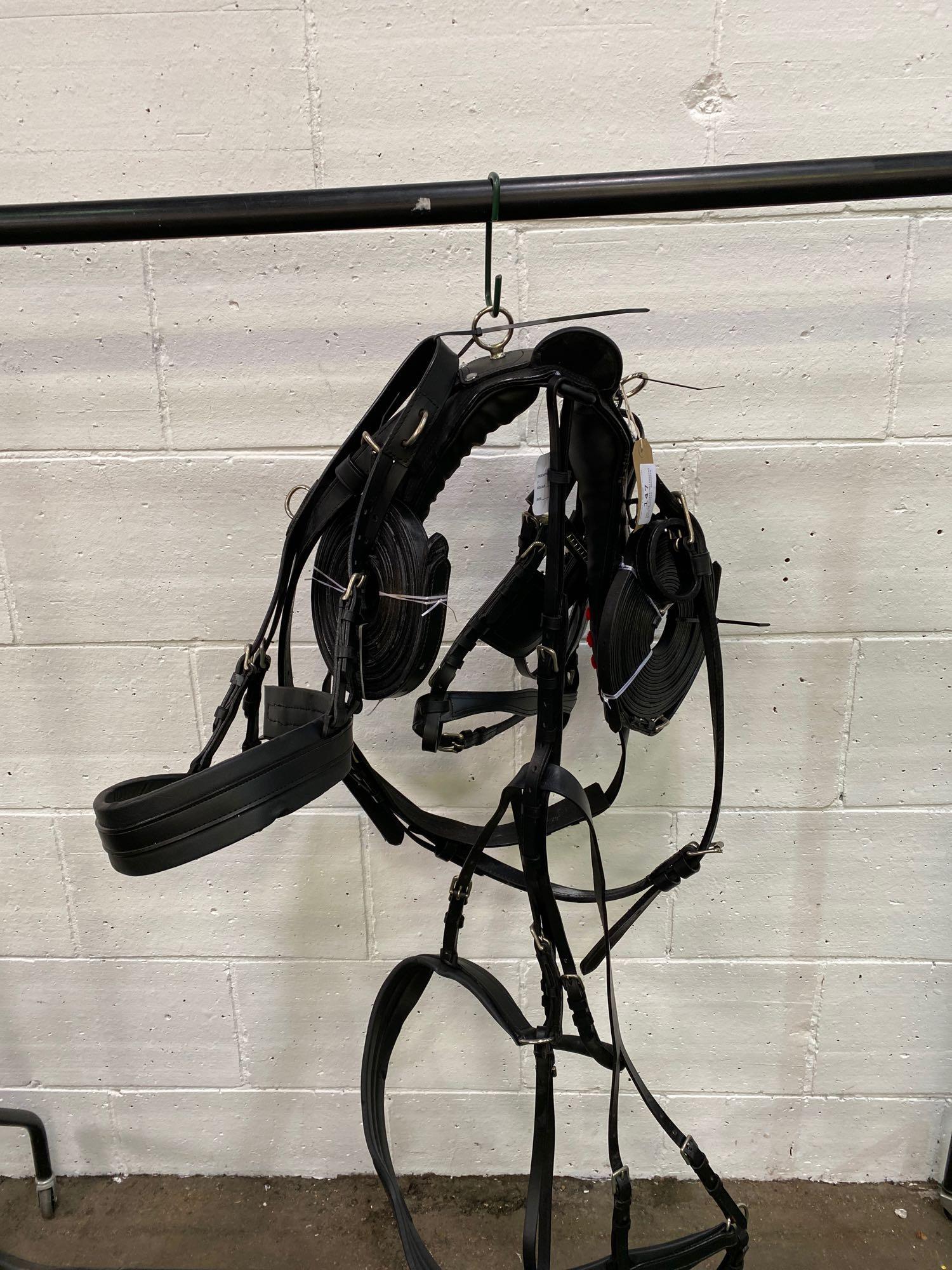 Set of black/whitemetal pony harness. This item carries VAT.