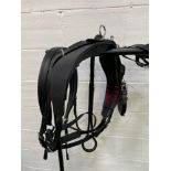 Set of black/whitemetal harness with brollar. This item carries VAT.