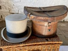 Grey top hat with a leather hat box.