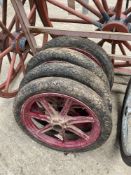 Four 19ins steel carriage wheels with pneumatic tyres