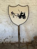 Wooden carriage and pair silhouette sign on post.