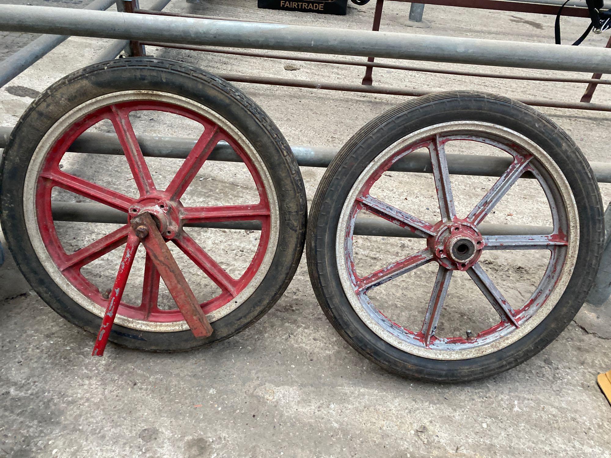A pair of 7 spoke aluminium wheels with pneumatic tyres