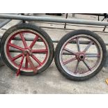 A pair of 7 spoke aluminium wheels with pneumatic tyres