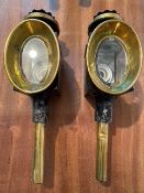 Pair of black/brass oval fronted carriage lamps.