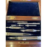 Mahogany box containing drawing instruments, and a S & Ds Champion pen