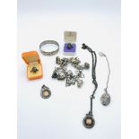 A silver charm bracelet and other silver jewellery