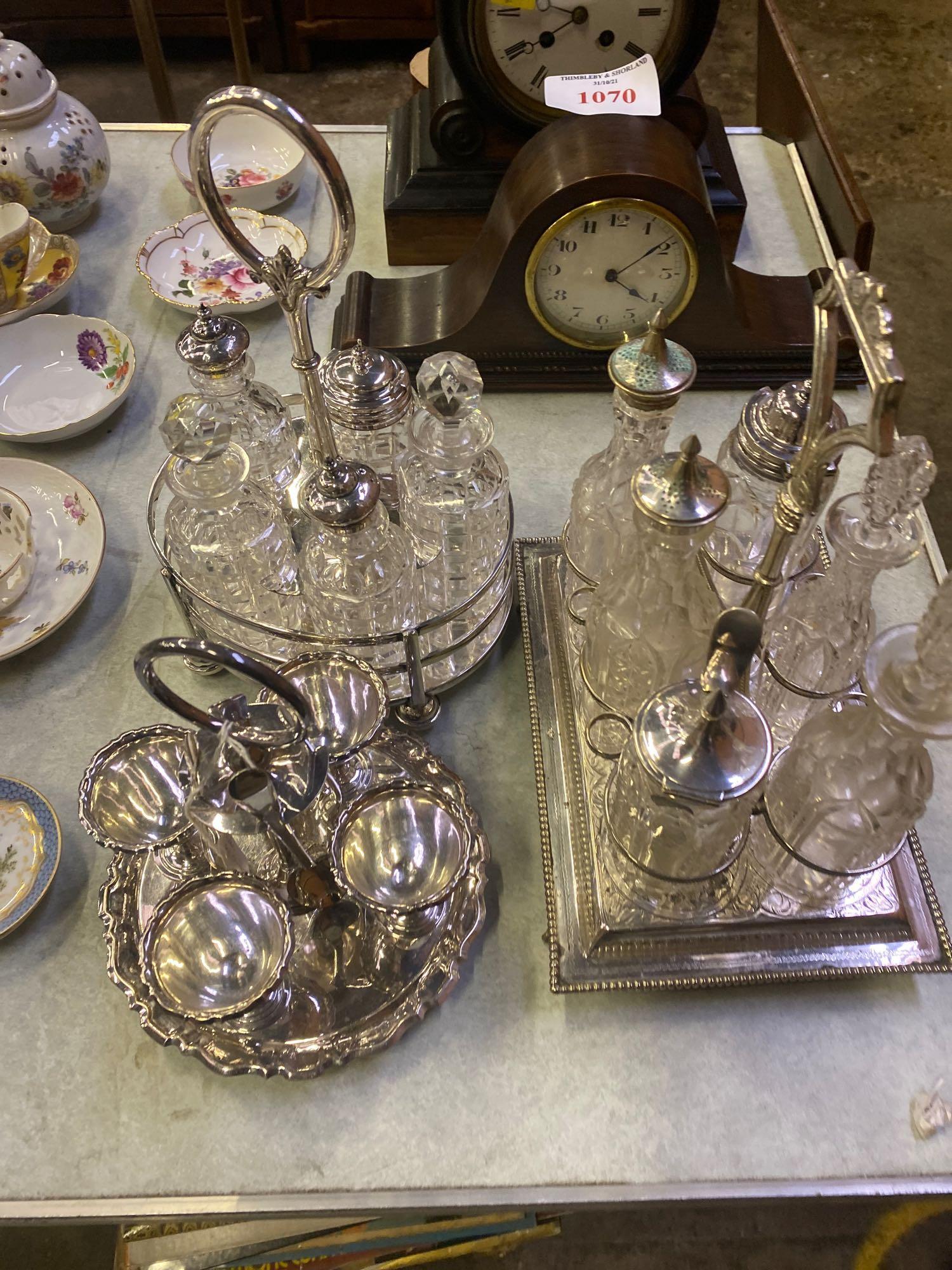 Three silverplate cruets and a silverplate egg stand