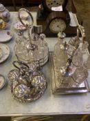 Three silverplate cruets and a silverplate egg stand