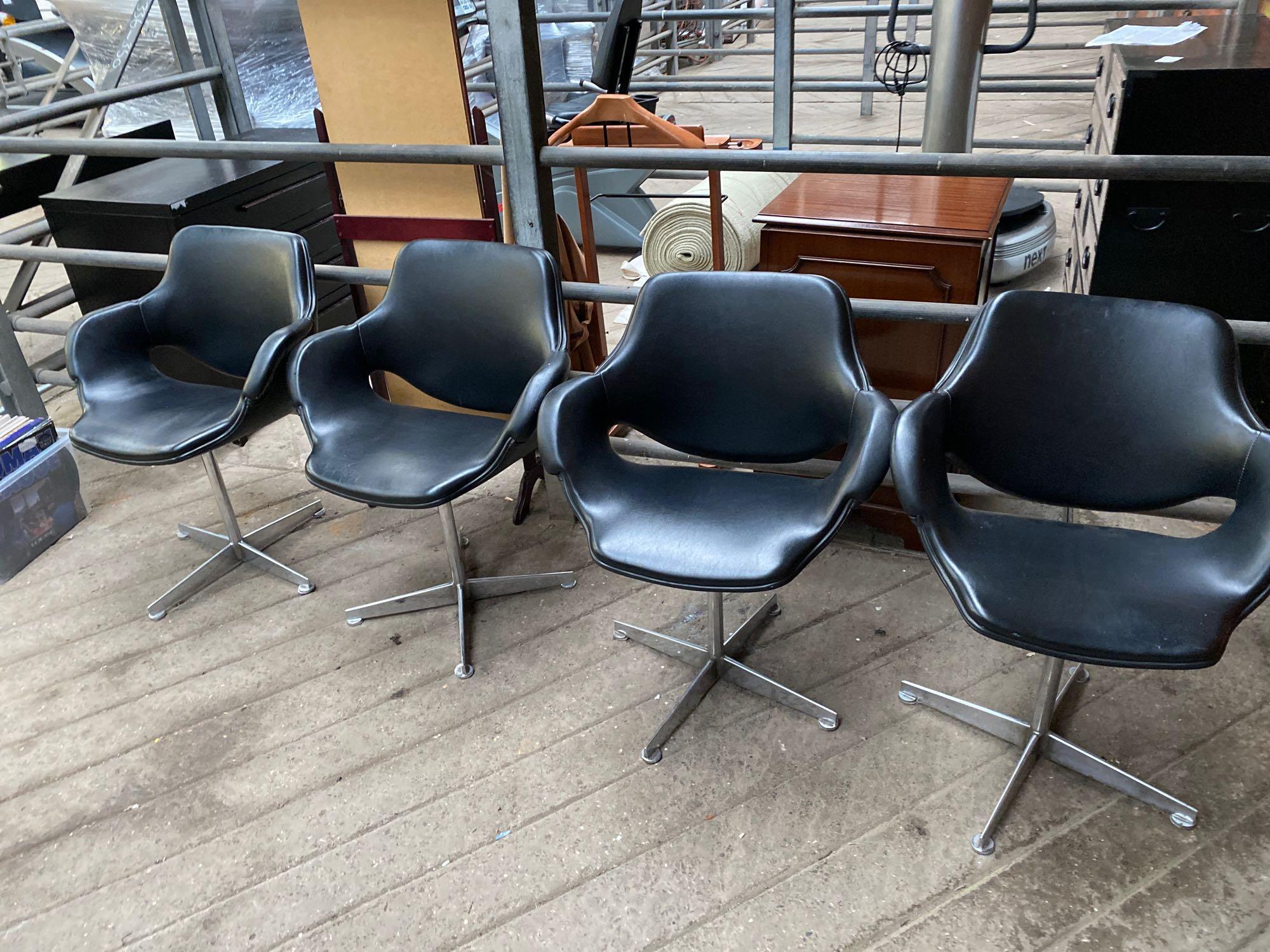 Four Eames style chairs