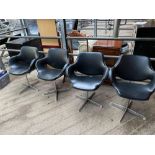 Four Eames style chairs