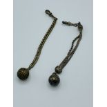 Two decorative ball fobs