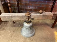 Brass bell with raised lettering