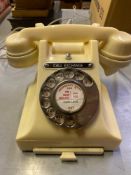 A bakelite rotary dial telephone, type 312