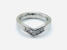 18ct white gold ring in wishbone design, channel set with five brilliant cut diamonds