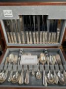 A canteen of silver plate cutlery, together with four Stuart crystal glasses
