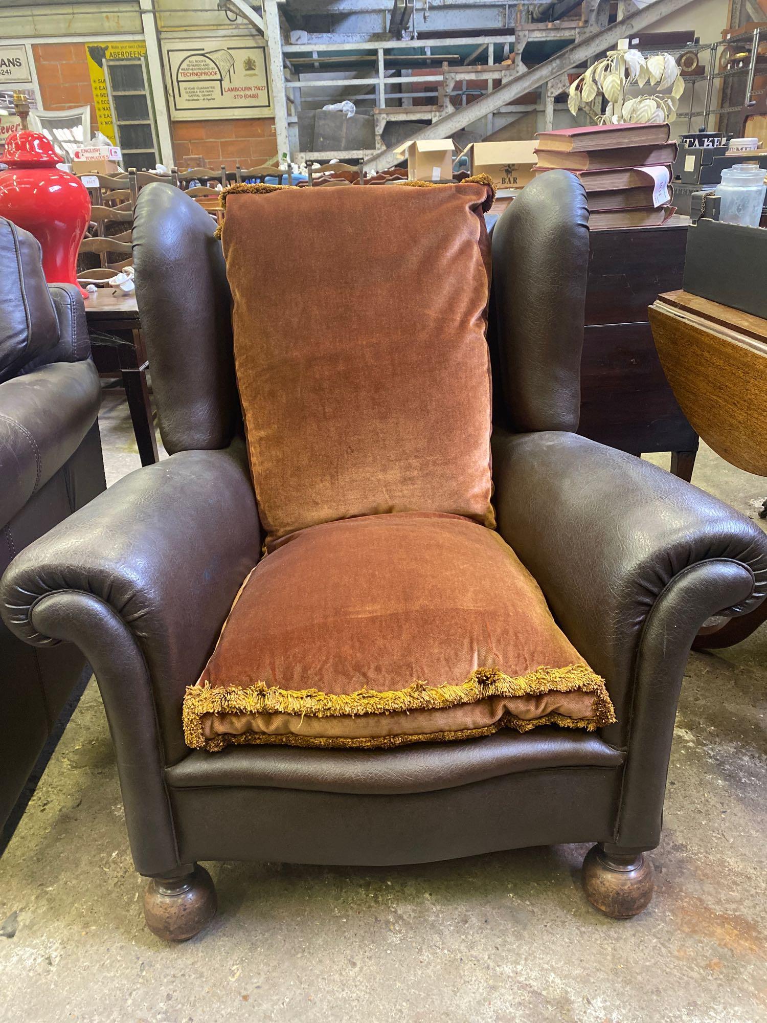 Dark brown faux leather deep wingback armchair
