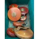 Eight leather cased tape measures
