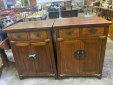 A pair of oriental style wood cabinets