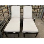 Two rattan style garden sun loungers