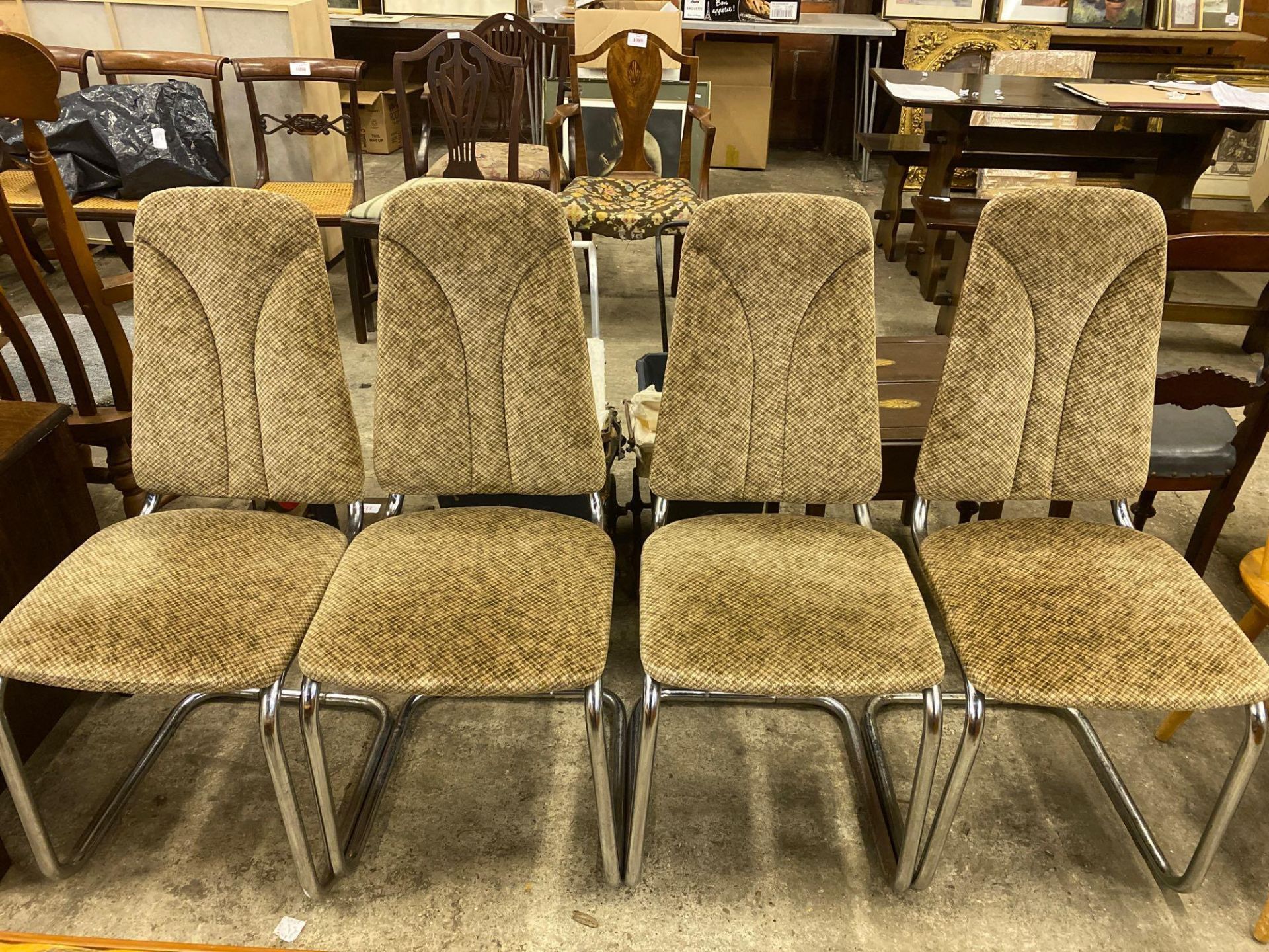 Four chrome dining chairs