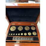 Three part boxed set of standard brass apothecary weights by Avery De Grave