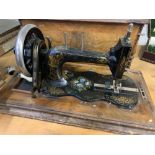 Manual sewing machine in walnut box decorated with parquetry