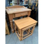 Low pine table together with a nest of tables