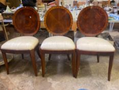 Three round back dining chairs and a foot stool