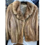Two fur evening jackets