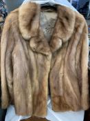 Two fur evening jackets