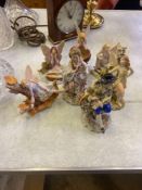 Two Capodimonte figures together with five ceramic faeries