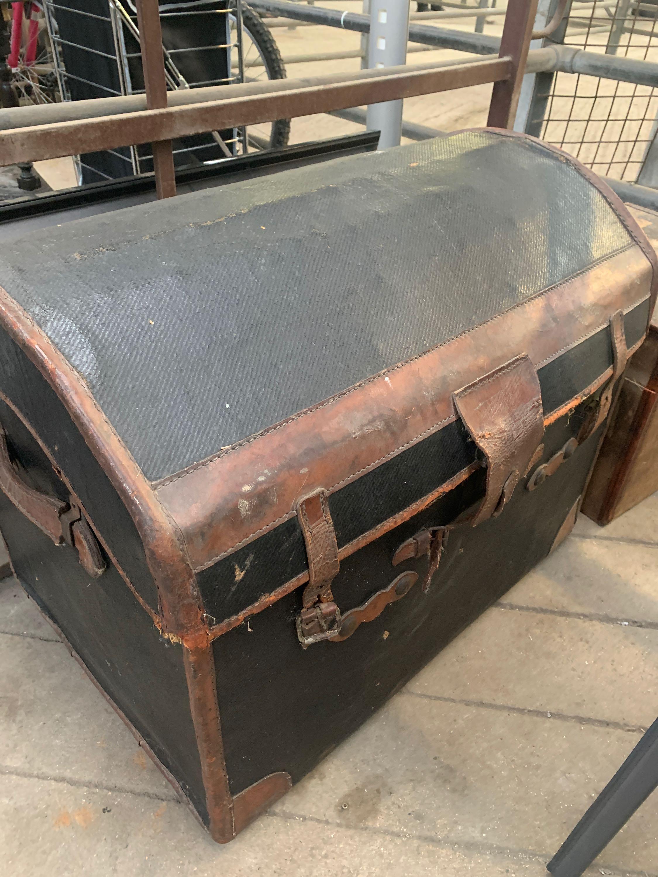 A dome top trunk together with a French hat box