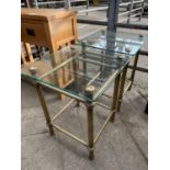 Two glass top side tables