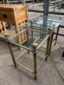 Two glass top side tables